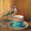 Still life of a goldfinch perched on a gold and turquoise tea cup